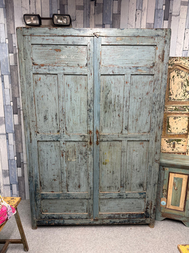 This expertly crafted solid wooden wardrobe from India showcases an exquisite distressed blue finish. The interior contains three fixed shelves, making it ideal for use as a pantry or linen storage solution. Minor imperfections are present, consistent with its intentional distressed aesthetic. A remarkable piece of functional furniture with authentic character.

Overall Dimensions

122cm wide x 46cm deep x 181.5cm high

DELIVERY AVAILABLE      

For our other items see our website https://fossewayfurniture.