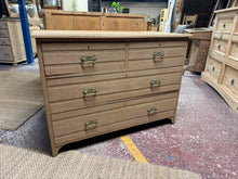 Load image into Gallery viewer, A beautiful stripped oak chest of drawers, restored to its natural wood finish. Features two short dovetail-jointed drawers above two spacious long drawers, offering practical storage with authentic craftsmanship. Structurally sound with minor character marks. The bare wood finish invites personalisation—consider applying wax or oil to enhance protection and bring out the grain. An ideal piece for those seeking genuine vintage furniture with timeless appeal.

Delivery Available

Overall Dimensions

107cm wi
