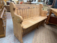 Load image into Gallery viewer, This striking stripped pine pew showcases the natural beauty of authentic pitch pine. With its bare finish, it may benefit from a protective wax coating to enhance durability and appearance. Dual handles on either side make repositioning effortless, while its versatile design suits dining areas, entryways, or period interiors. A timeless piece that brings warmth and character to any space.

Delivery Available

Overall Dimensions

126cm wide x 50cm deep x 90cm high

