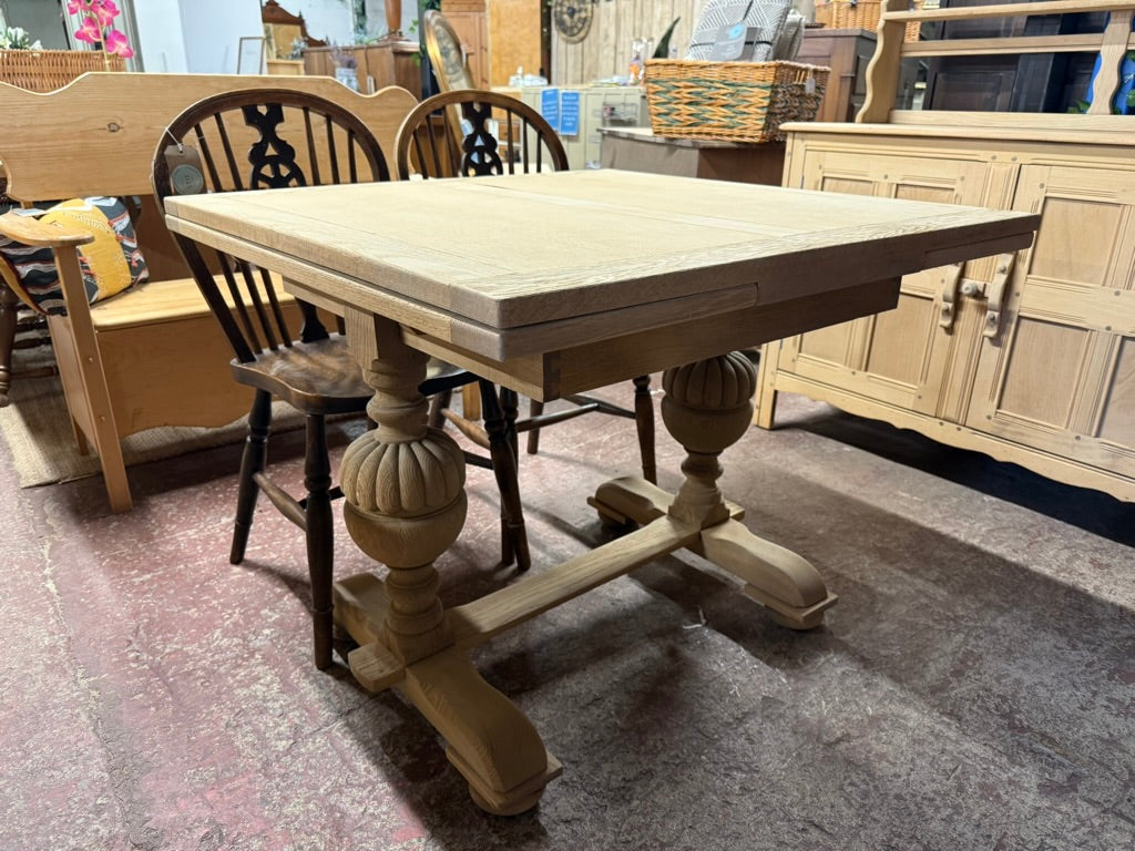 This beautiful oak extendable table has been fully restored to its natural finish and will need a wax coat to protect it. It extends effortlessly to accommodate 6-8 guests, making it ideal for entertaining. The tabletop separates from the base for easier transport. Structurally solid and in good condition overall , the only flaw is it has a minor veneer lift on the top but that can be easily fixed.

Overall Dimensions

91cm wide x 91cm deep x 74cm high

each leaf is an extra 30cm wide (60cm total when exten