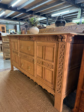 Load image into Gallery viewer, This stunning solid oak sideboard stripped to reveal its natural grain and character. Structurally sound with minor surface marks that can be concealed with wax finish. Features two cupboards and two dovetail-jointed drawers offering generous storage. Would benefit from protective wax treatment. A striking statement piece for any dining room or hallway.

Delivery Available

Overall Dimensions

183cm wide x 61cm deep x 95cm high&nbsp;

