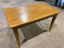 Load image into Gallery viewer, A sturdy oak dining table built to withstand daily use and entertaining. This solid wood piece seats 4-6 guests comfortably and maintains its structural integrity despite showing the natural wear of a well-loved home. Surface marks are minimal and consistent with its pre-owned status. A dependable choice for families seeking authentic furniture with genuine character and lasting value.

Delivery Available

Overall Dimensions

122cm long x 76cm deep x 75cm high

