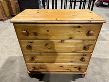 Load image into Gallery viewer, A sturdy solid pine chest of drawers featuring four spacious drawers for practical storage. This ducal pine piece is structurally solid and fully functional, though it bears some surface marks. Perfect for those seeking a candidate for refinishing—whether through a fresh coat of paint or careful sanding to restore its natural beauty.&nbsp;

Delivery Available

Overall Dimensions

87cm wide x 45cm deep x 85cm high

