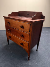 Load image into Gallery viewer, A sturdy oak and mahogany chest of drawers in solid working condition. Features three spacious long drawers ideal for storage. The piece shows minor surface marks consistent with age and use, but remains structurally sound. Its classic design and robust construction make it equally suited to traditional interiors or creative projects, such as conversion into a vanity unit or wash basin.

Delivery Available

Overall Dimensions

83cm wide x 42cm deep x 79cm / 89cm high&nbsp;

