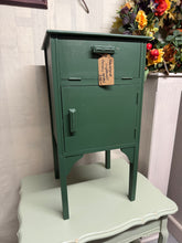 Load image into Gallery viewer, A striking mahogany storage cupboard finished in Farrow &amp; Ball's sophisticated 'Beverly Green'. Features a pull-down drawer and compact cupboard compartment, offering practical storage without compromising on style. The refined paint treatment and traditional craftsmanship make this an elegant addition to any entryway or living space, combining functionality with distinctive character.

Delivery Available

Overall Dimensions

35.5cm wide x 35.5cm deep x 67cm high

