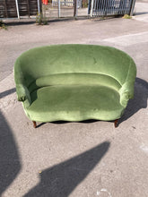 Load image into Gallery viewer, This charming green velvet two-seater sofa brings a fresh pop of color and cozy comfort to any living space. Structurally sound and well-built, it has been gently used and remains in overall good condition. While it shows some minor marks, they do not detract from its inviting appearance or comfort. Perfect for relaxing with a book or entertaining guests, this sofa combines style and practicality to brighten your home.

Delivery Available

Overall Dimensions

approx : 148cm wide x 95cm deep x 85cm high / 35
