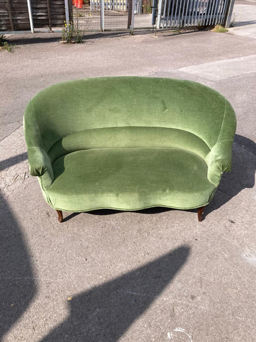 This charming green velvet two-seater sofa brings a fresh pop of color and cozy comfort to any living space. Structurally sound and well-built, it has been gently used and remains in overall good condition. While it shows some minor marks, they do not detract from its inviting appearance or comfort. Perfect for relaxing with a book or entertaining guests, this sofa combines style and practicality to brighten your home.

Delivery Available

Overall Dimensions

approx : 148cm wide x 95cm deep x 85cm high / 35