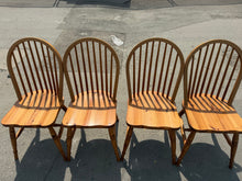 Load image into Gallery viewer, A charming set of four pine dining chairs, each structurally sound and ready for everyday use. Displaying the natural character of used pieces, these chairs bear gentle signs of age and use that add authentic appeal. Ideal for creating a warm, rustic atmosphere in a country-style kitchen or dining room.

Delivery Available

Overall Dimensions

approx : 41cm wide x 43cm deep x 90cm high

