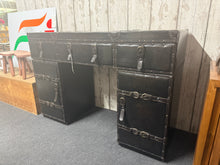 Load image into Gallery viewer, A practical double pedestal desk with faux leather finish, offering excellent storage across three drawers and two cupboards. Structurally sound and in good condition with minor cosmetic wear consistent with use. Ideal for home offices or studies requiring organised workspace and ample document storage.

Delivery Available

Overall Dimensions

111cm wide x 41cm deep x 75cm high&nbsp;
