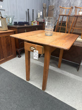 Load image into Gallery viewer, A charming Victorian pine drop leaf dining table with authentic period character. Structurally sound and well-preserved for its age, this versatile piece features fold-down leaves for flexible dining arrangements and a practical front drawer for convenient storage. Ideal for period homes or those seeking genuine vintage furniture with practical functionality.

Delivery Available

Overall Dimensions

Extended : 83cm wide x 86cm deep x 78cm high

