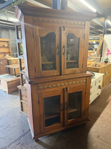 This beautiful hardwood dresser combines classic charm with practical storage solutions. Crafted from durable hardwood, it remains structurally sound and ready to enhance your space. While it shows some gentle signs of use, these minor marks add character without detracting from its overall appeal. The dresser features two spacious drawers at the top, perfect for organizing smaller items, above two larger drawers and a cupboard at the base, offering plenty of room for clothes, linens, or household essential