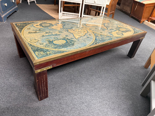 This charming coffee table showcases a brass-framed glass top featuring an antique-style world map beneath. While it has some light signs of use, these are minimal and add to its unique character. It’s sure to be a delightful conversation starter in any room.

Delivery Available

Overall Dimensions

129cm wide x 68cm deep x 36cm high
