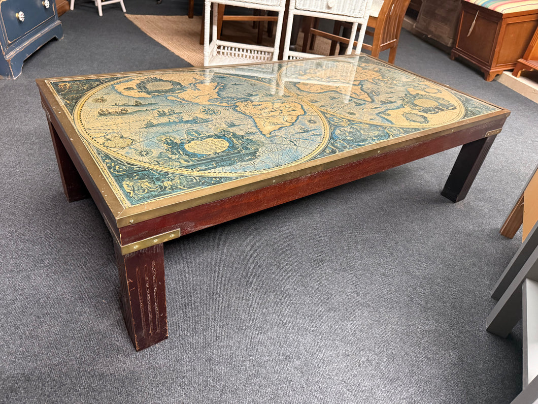 This charming coffee table showcases a brass-framed glass top featuring an antique-style world map beneath. While it has some light signs of use, these are minimal and add to its unique character. It’s sure to be a delightful conversation starter in any room.

Delivery Available

Overall Dimensions

129cm wide x 68cm deep x 36cm high
