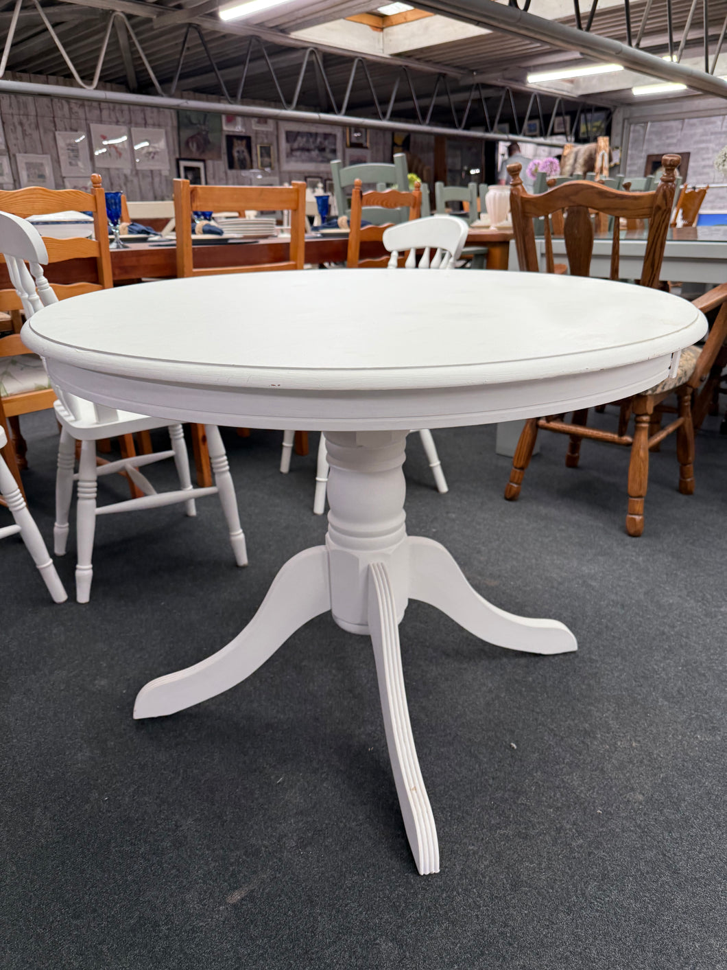 This Round Dining Table features a wooden design that has been expertly painted a bright white by previous owners. While there may be a few minor marks, it comfortably seats 4-5 people and the top can be easily detached from the base for convenient moving.

Overall Dimensions

100cm diameter x 75cm high

DELIVERY AVAILABLE      

For our other items see our website https://fossewayfurniture.co.uk

collection from our shop at cv36, our collection zone at bs36 or otherwise delivery is available
