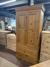 Load image into Gallery viewer, A charming narrow solid pine wardrobe with genuine character. Built from solid pine with structural integrity intact, it features one hanging rail and two dovetail-jointed drawers—ideal for compact spaces or a bedroom refresh. The piece shows honest wear and patina from use, which adds authenticity and makes it perfect as-is or ready for painting to match your décor. Quality craftsmanship meets practical storage in one versatile frame.

Delivery Available

Overall Dimensions

92cm wide x 58cm deep x 186cm h
