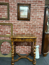 Load image into Gallery viewer, This elegant William &amp; Mary reproduction set combines timeless design with practical functionality. The table showcases distinctive barley twist legs and includes a dovetail-jointed drawer for convenient storage, while the matching mirror features authentic natural patina. Both pieces are structurally sound and in excellent condition, making them ideal for creating a sophisticated home office or welcoming entryway display.

Delivery Available

Overall Dimensions

Table : 71cm wide x 49cm deep x 81.5cm h
