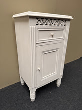 Load image into Gallery viewer, A charming vintage pot cupboard with solid construction and reliable storage. This pre-loved piece features a single drawer and enclosed cupboard, offering practical space for your kitchen essentials. While it shows its age with visible wear, the sturdy frame is ready for a fresh coat of paint to restore it to its former glory.&nbsp;

Delivery Available

Overall Dimensions

40cm wide x 30cm deep x 71cm high&nbsp;&nbsp;


