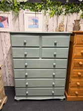 Load image into Gallery viewer, A charming solid pine chest of drawers with authentic character. This tall storage piece features a gently distressed finish that adds warmth and vintage appeal to any bedroom or hallway. Eight generous drawers—four shorter drawers above four longer ones—provide ample space for clothing, linens, and personal items. Structurally sound and in excellent condition, it's a practical and stylish addition to your home.

Delivery Available

Overall Dimensions

91.5cm wide x 44cm deep x 120cm high

