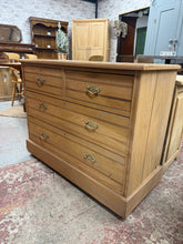Load image into Gallery viewer, Discover the natural beauty of this charming satinwood chest of drawers, lovingly restored to reveal its original character. Featuring a practical arrangement of two compact dovetail-jointed drawers above two spacious ones, it offers excellent storage versatility. With its authentic patina and minor signs of age, this piece brings genuine vintage appeal to any room. A light wax finish will enhance the wood's warmth and protect its surface, making it a wonderful addition to homes that celebrate timeless craf

