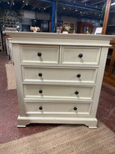 Load image into Gallery viewer, A charming off-white chest of drawers that brings contemporary style to any bedroom or living space. This well-built piece features a practical two-short-over-three-long drawer configuration, offering plenty of storage for your essentials. While it bears a few expected marks of pre-loved furniture, it remains in solid working condition and ready to serve you beautifully for years to come.

Overall Dimensions

90cm wide x 42cm deep x 98cm high

DELIVERY AVAILABLE      

For our other items see our website ht
