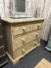 Load image into Gallery viewer, Solid pine chest of drawers featuring a beautiful distressed aged finish that adds character and charm. The piece combines practical storage with timeless appeal, offering two short dovetail-jointed drawers positioned above two spacious long drawers. Structurally sound and well-maintained, this versatile unit works beautifully in bedrooms, living spaces, or hallways.&nbsp;

Delivery Available

Overall Dimensions

81.5cm wide x 45cm deep x 69cm high

