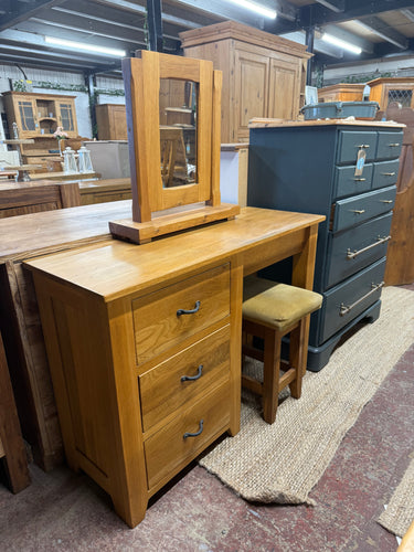 This beautiful oak dressing table set is sturdy and generally in good shape. While it shows some signs of use with minor marks, they are not overly noticeable. Featuring three small drawers for storage, it also includes a mirror and a stool, though the stool may need new upholstery.

Overall Dimensions

110cm wide x 40cm deep x 77cm high

DELIVERY AVAILABLE      

HAVE THIS PAINTED A COLOUR OF YOUR CHOICE FOR AN EXTRA £100 OR HAVE IT COMPLETELY STRIPPED BACK FOR JUST £120    

For our other items see our we