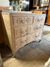 Load image into Gallery viewer, Discover the raw beauty of this charming oak chest of drawers, lovingly stripped to reveal its natural character. Featuring two small dovetail-jointed drawers positioned above two long ones, it offers versatile storage solutions. The piece showcases exquisite hand-carved details adorning the top and drawer fronts, adding timeless elegance to any room. A protective wax finish is recommended to enhance and preserve its gorgeous wood grain.

Overall Dimensions

86cm wide x 46cm deep x 80cm high

DELIVERY AVAIL
