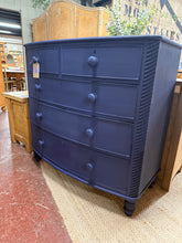 Load image into Gallery viewer, A charming mahogany chest of drawers finished in Farrow and Ball's 'Titmouse Blue'. The piece shows gentle signs of age with minor surface marks, though the structure remains solid and reliable. It features two dovetail-jointed drawers at the top, with three deeper drawers below, providing versatile storage options. A characterful addition to any room.

Delivery Available

Overall Dimensions

104cm wide x 55cm deep x 119cm high
