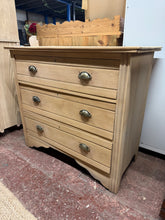 Load image into Gallery viewer, Discover the natural beauty of this exceptional satinwood chest of drawers, stripped back to reveal its original character. With three spacious drawers, it offers practical storage while showcasing the wood's authentic grain and warmth. A simple wax finish will enhance and protect this timeless piece, making it a wonderful addition to any home.

Overall Dimensions

91cm wide x 45cm deep x 81cm high

DELIVERY AVAILABLE      

For our other items see our website https://fossewayfurniture.co.uk

collection fro
