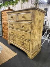 Load image into Gallery viewer, A characterful chest of drawers featuring an expertly applied distressed finish that adds vintage charm to any interior. Built to last with solid construction and dovetail-jointed drawers for durability. Configured with two short drawers above three generous long drawers, offering practical storage with authentic period appeal. A striking focal point that complements both traditional and contemporary settings.

Delivery Available

Overall Dimensions

105.5cm wide x 51cm deep x 109cm high

