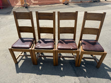 Load image into Gallery viewer, A set of four solid oak dining chairs with authentic character. Each chair is structurally sound and ready for restoration or upcycling projects. The natural wear and patina add charm and potential for creative refinishing. Ideal for those seeking quality pieces with personality and purpose.

Delivery Available

Overall Dimensions

approx : 47cm wide x 44cm deep x 107cm high&nbsp;

