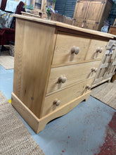 Load image into Gallery viewer, This solid pine chest of drawers showcases beautiful natural wood grain after being stripped back to bare wood. The classic configuration features two short drawers above two spacious long drawers, offering practical storage for any room. Structurally sound and in good condition, it's ready for finishing with wax or your choice of stain or paint to match your décor.

Delivery Available

Overall Dimensions

86cm wide x 43cm deep x 81cm high

