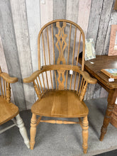 Load image into Gallery viewer, A charming vintage highback Windsor armchair with solid construction and authentic character. Its timeless design brings warmth and elegance to country-style interiors, studies, or traditional living spaces. Well-preserved and ready to become a cherished focal point in your home.

Delivery Available

Overall Dimensions

approx : 63cm wide x 46.5cm deep x 117cm high

