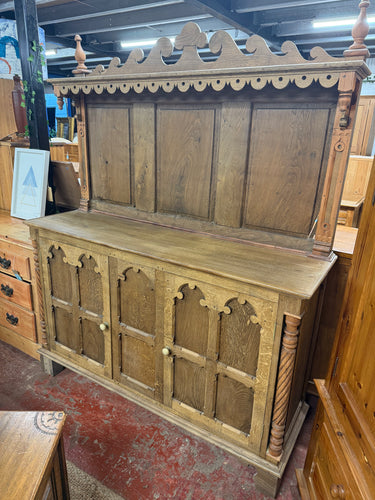 This beautiful gothic-style oak dresser is solidly built and well-maintained for its age. It has been carefully stripped and varnished to highlight its natural colour. Although it has some minor marks and slight damage, these do not interfere with its functionality. It includes two cupboards, providing useful storage space. The top does come away from the base for easier moving.

Overall Dimensions

142cm wide x 43cm deep x 180cm high

DELIVERY AVAILABLE      

For our other items see our website https://fo