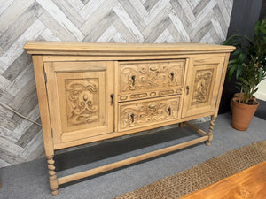 This exquisite oak sideboard has been fully restored to its original condition and may require a layer of wax for protection. The elegant drawer and door fronts showcase intricate carvings, while the piece is supported by stunning barley twist legs. It offers ample storage with 2 long dovetail jointed drawers and 2 cupboards.

Overall Dimensions

149.5cm wide x 45cm deep x 94cm high

DELIVERY AVAILABLE      

For our other items see our website https://fossewayfurniture.co.uk

collection from our shop at cv