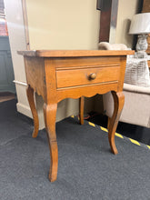Load image into Gallery viewer, A charming solid pine side table with authentic character and solid structural integrity. This versatile piece features a practical front drawer for storage and works beautifully as a lamp table or bedside accent. Showing its age with light wear and patina, it's an excellent candidate for refinishing—a light sand or fresh paint will restore it to like-new condition. Ideal for vintage enthusiasts or those seeking sustainable, quality furniture with timeless appeal.

Delivery Available

Overall Dimensions

60
