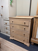 Load image into Gallery viewer, This beautiful oak chest of drawers has been carefully stripped back to reveal the natural wood grain, showcasing quality craftsmanship. The piece is structurally sound with minor cosmetic marks that add character. Four spacious dovetail-jointed drawers provide excellent storage capacity. A protective coat of wax is recommended to enhance and preserve the finish. Ideal for those seeking authentic vintage furniture with genuine character and durability.

Delivery Available

Overall Dimensions

77cm wide x 46
