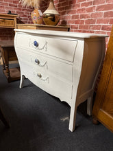 Load image into Gallery viewer, This charming small French-style chest of drawers is finished in a fresh, bright white. It is sturdy and well-maintained, featuring three spacious drawers ideal for storage. A delightful addition to a hallway or nursery.

Delivery Available

Overall Dimensions

90cm wide x 31cm deep x 71cm high&nbsp; &nbsp; &nbsp;

