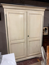 Load image into Gallery viewer, This impressive French painted double wardrobe combines timeless elegance with practical storage. Structurally sound and in excellent condition, it features generous capacity with 4 shelves and 2 hanging rails to accommodate your entire wardrobe. The piece arrives complete with its original key. For convenient delivery, the wardrobe disassembles easily and will be dismantled before delivery/collection.

Delivery Available

Overall Dimensions

154cm wide x 66cm deep x 206cm high


