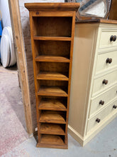 Load image into Gallery viewer, This charming narrow solid pine bookcase is sturdy and in good condition overall. Although it’s previously used and shows some minor marks, they are nothing significant. Featuring seven fixed shelves, it offers plenty of storage space for your books and treasures.

Delivery Available

Overall Dimensions

33cm wide x 19cm deep x 127cm high&nbsp; &nbsp; &nbsp; 

