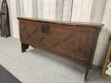 Load image into Gallery viewer, This exceptional 18th century oak coffer combines authentic period character with practical storage. Structurally sound and well-preserved, it displays the natural patina and minor marks that speak to its age and heritage. The hinged lid opens to generous storage space, making it both a striking focal point and a functional piece for any room. A genuine antique treasure for collectors and those seeking distinctive, timeless furniture.

Delivery Available

Overall Dimensions

111cm wide x 38cm deep x 57cm hi
