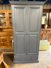 Load image into Gallery viewer, This beautiful solid pine wardrobe is sturdy and well-maintained overall. It may benefit from a small touch-up, but nothing significant. Although not shown in the photos, it includes a hanging rail. Additionally, there is a spacious dovetail-jointed drawer for extra storage.

Overall Dimensions

92cm wide x 59cm deep x 190.5cm high

DELIVERY AVAILABLE    

For our other items see our website https://fossewayfurniture.co.uk

