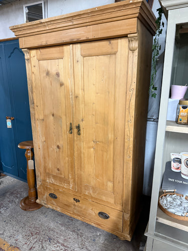 This charming antique pine wardrobe is solidly built and generally well-preserved. It shows signs of use with some marks, but a polish will easily refresh it. Offering plenty of storage, it features one long dovetail-jointed drawer and a hanging rail. Please note, this wardrobe cannot be taken apart. It comes complete with its original key.

Overall Dimensions

110cm wide x 58cm deep x 178.5cm high

DELIVERY AVAILABLE      

For our other items see our website https://fossewayfurniture.co.uk

collection fro