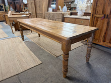 Load image into Gallery viewer, Authentic vintage pine dining table, approximately 8ft long, built to last. Structurally sound with characteristic patina and minor wear that speaks to its age and history. Comfortably seats 8–10 people, making it ideal for family gatherings and entertaining. A genuine piece with genuine character for those who appreciate well-loved furniture.

Delivery Available

Overall Dimensions

242cm long x 81cm wide x 76cm high

