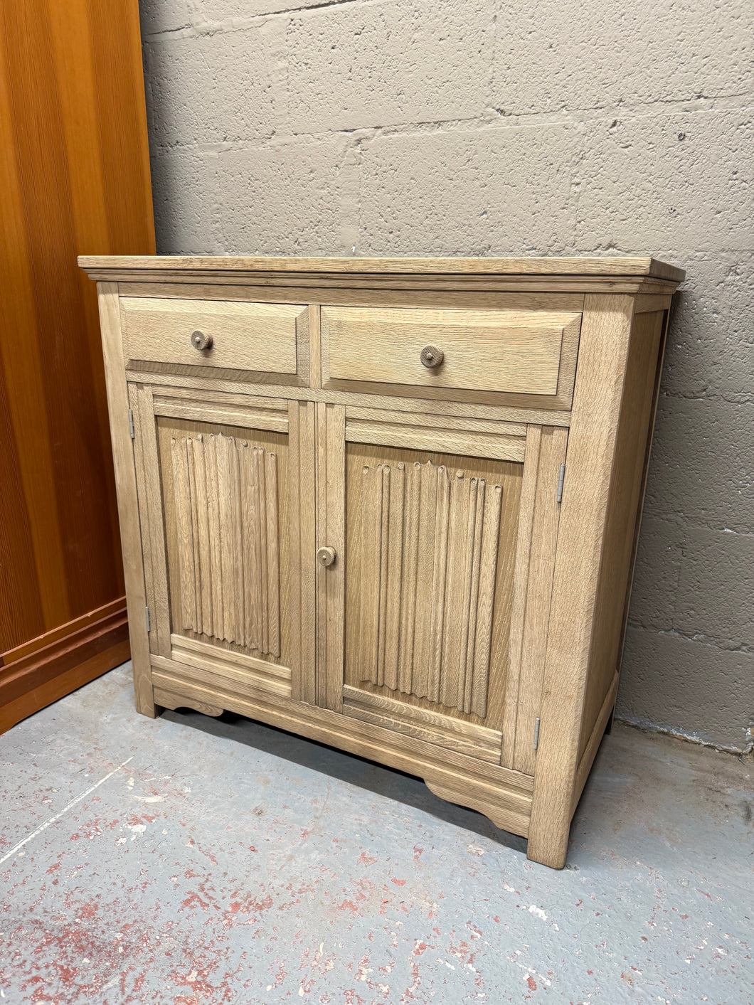 This beautiful stripped oak sideboard is solidly built and generally well maintained. Fully stripped to reveal its natural finish, it would look great with a layer of wax to protect the surface. It offers plenty of storage space, featuring two short dovetail-jointed drawers above a double cupboard with a single shelf inside.

Overall Dimensions

95cm wide x 46.5cm deep x 92cm high

DELIVERY AVAILABLE      

For our other items see our website https://fossewayfurniture.co.uk

collection from our shop at cv36