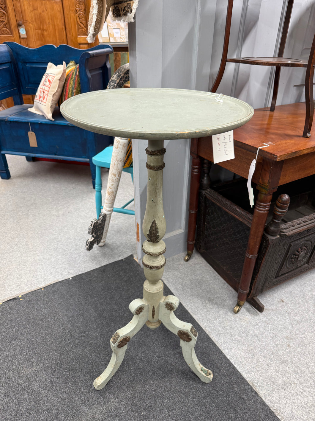 This charming hand-painted plant stand / side table is sturdy and well-maintained. While it shows a few signs of wear, these only enhance its character. Ideal for displaying your favourite vase or enjoying a cosy cup of coffee.

Delivery Available

Overall Dimensions

40.5cm diameter x 90cm high  
