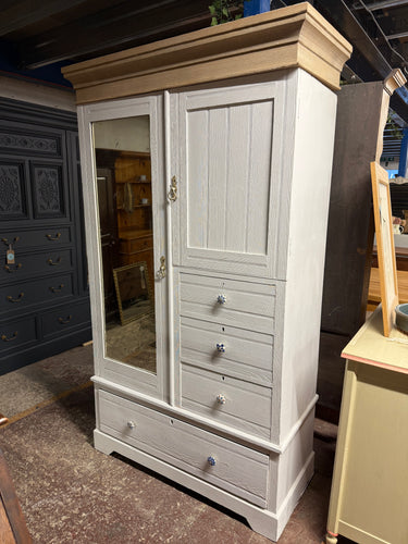 This beautiful oak wardrobe features a fresh white paint finish. While it shows some signs of previous use, a little touch-up will easily restore its charm. Offering plenty of storage space, it includes three small dovetail-jointed drawers, one large drawer, a long cupboard with several hanging hooks, and a smaller cupboard with a shelf. For convenience, it can be taken apart into three sections to make moving simpler.

Overall Dimensions

117cm wide x 54cm deep x 202cm high

DELIVERY AVAILABLE      

For o