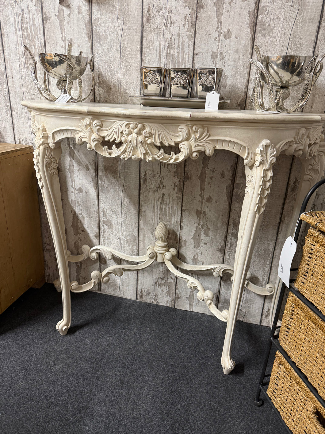 This beautiful French style console table is sturdy and well-preserved. It shows some signs of use, but only minor marks that don’t take away from its charm. The intricate carved details will bring a lovely sense of sophistication to any space.

Delivery Available

Overall Dimensions

101cm wide x 39cm deep x 83cm high  
