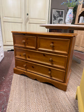 Load image into Gallery viewer, A charming solid pine chest featuring sturdy dovetail jointed construction. This compact piece combines practicality with timeless appeal, offering two short drawers and two long drawers for versatile storage. The natural finish showcases the wood's character, with minor marks that add to its authentic vintage charm. Structurally sound and ready to enhance any bedroom or living space.

Delivery Available

Overall Dimensions

80cm wide x 44cm deep x 63cm high

