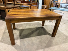 Load image into Gallery viewer, This solid hardwood dining table combines durability with practical design. While it bears the natural patina of use with minor surface marks, the structure remains robust and reliable. Accommodating 4 to 6 diners comfortably, it's an honest choice for families seeking a well-built table that prioritises function over flawless aesthetics.

Delivery Available

Overall Dimensions

140cm long x 91cm deep x 78cm high&nbsp;
